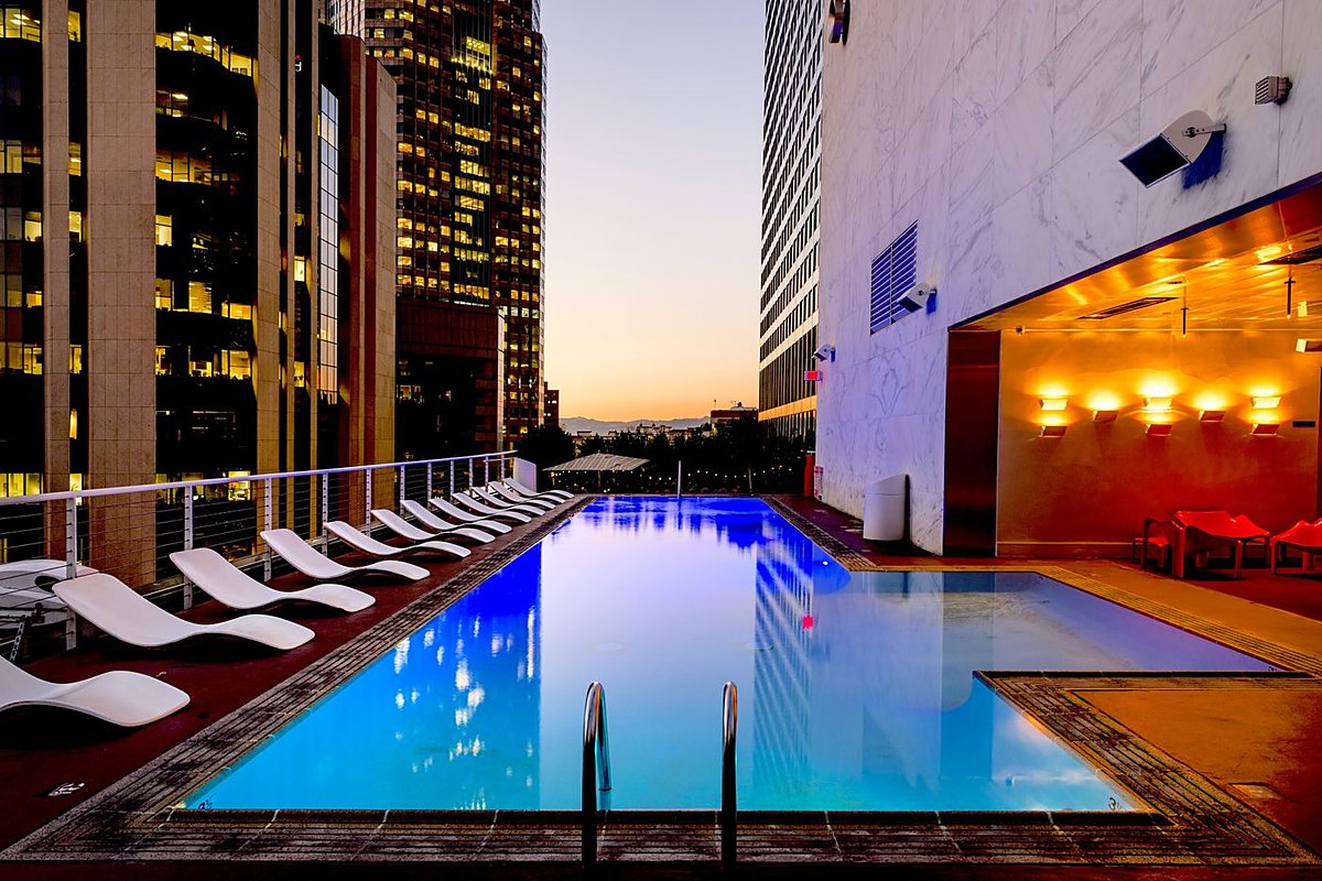 A pool and spa at dusk